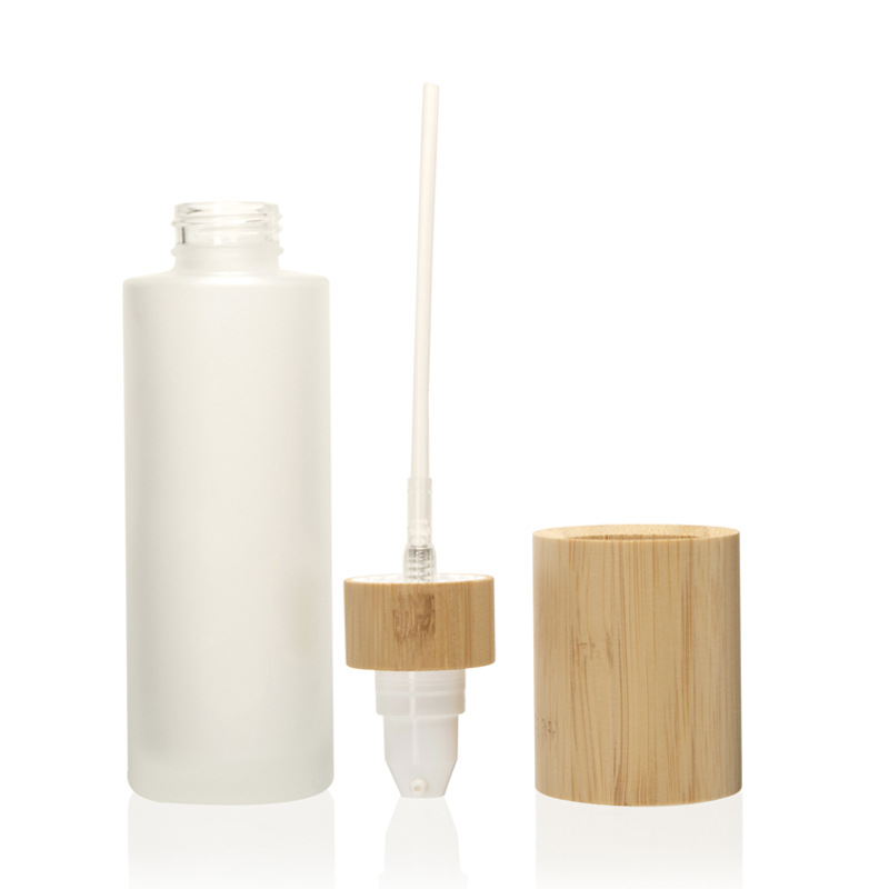 Nagyelo na cosmetic lotion pump fine mist at lotion glass spray bote na may takip na kahoy na kawayan Nagyelo na cosmetic lotion pump fine mist at lotion glass spray bote na may takip na kahoy na kawayan